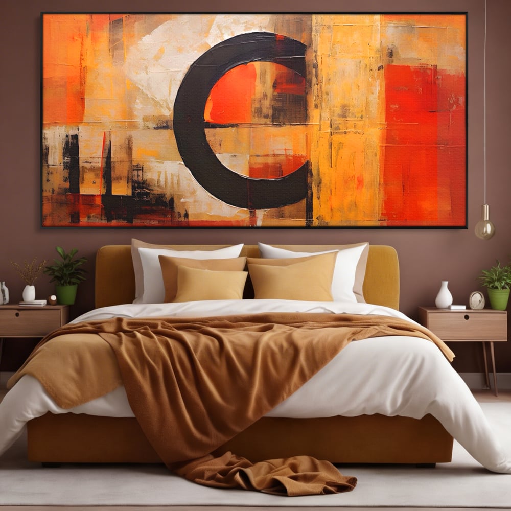 Tablou canvas cu pictura abstracta cu cerc negru, in rama de aluminiu negru, pe perete intr-un dormitor